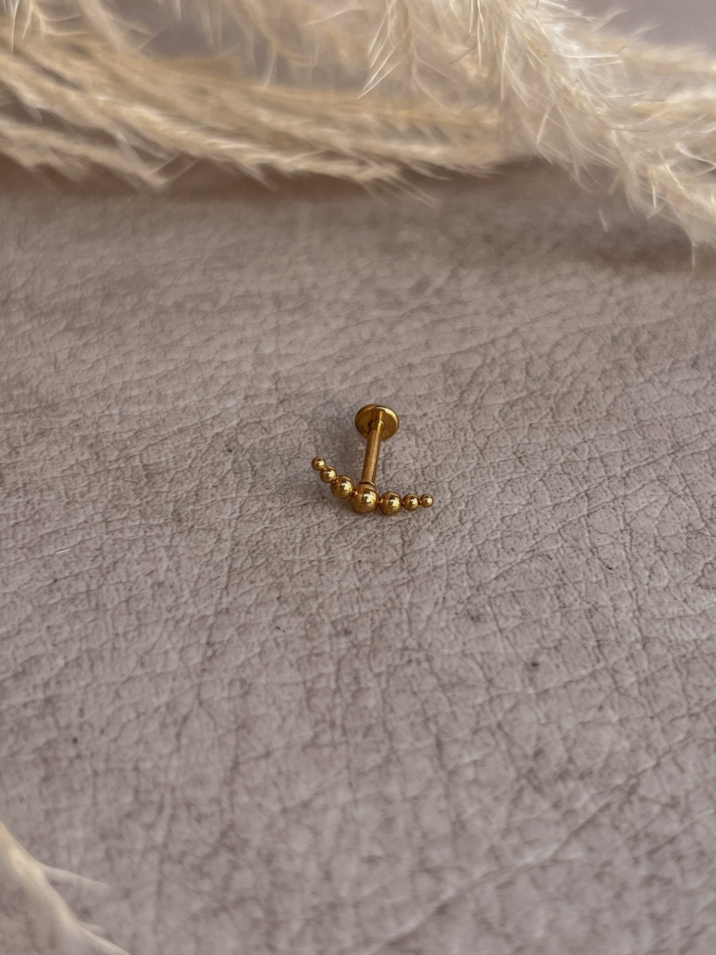 Piercing destello dorado