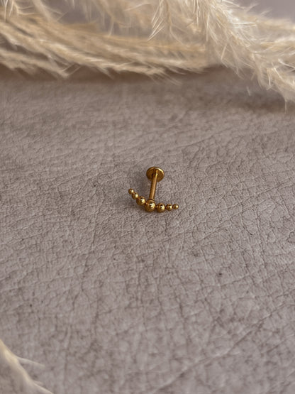 Piercing destello dorado