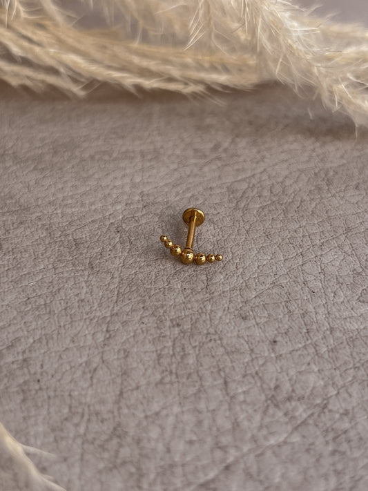 Piercing destello dorado