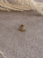 Piercing destello dorado
